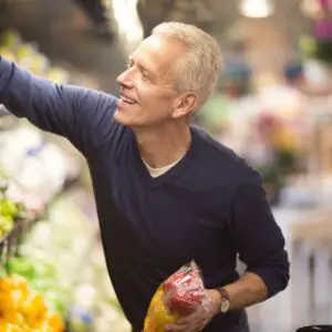 senior man goes grocery shopping royalty free image 1671747031