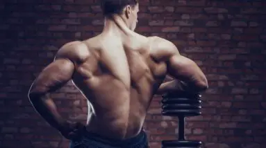 bodybuilder strong man pumping up back muscles royalty free image 1632946682